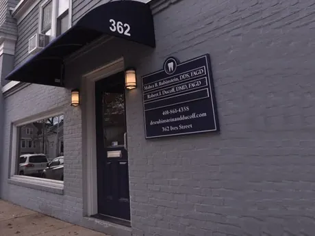The door at 362 Ives Street under its black awning, with the practice's nameplate beside it.